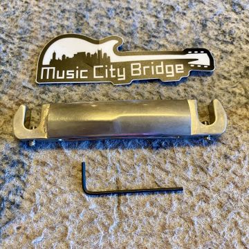 LEFTHANDED MUSIC CITY BRIDGE "THE SAVVY" , COMPENSATED WRAPAROUND TAILPIECE, AGED