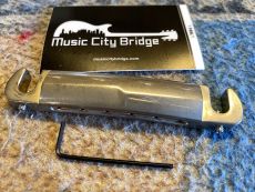 MUSIC CITY BRIDGE "THE SAVVY" , COMPENSATED WRAPAROUND TAILPIECE, AGED